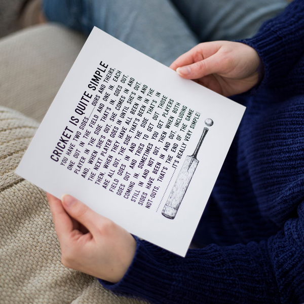 closeup of womans hands holding an unframed cricket is quite simple quote typographic art print