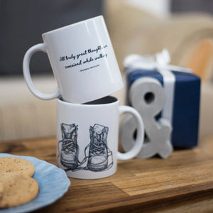 Walking-themed gift: two stacked mugs with a Friedrich Nietzsche walking quote and a beautiful walking boots illustration.