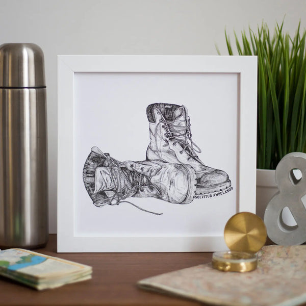 Vintage walking boots framed art by wit and wisdomuk