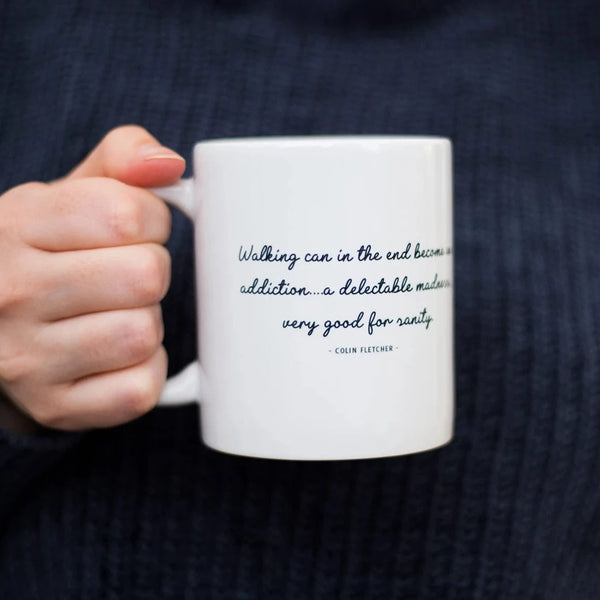 Womans hand holding a Walking Addiction Quote Mug - Hiking Enthusiast Gift