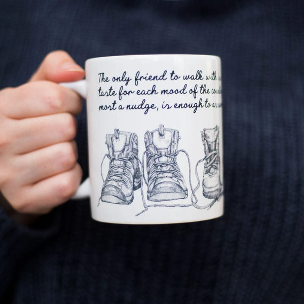 Closeup of womans hand holding a Walking Friends Quote Mug - Perfect Gift for Hikers in the UK