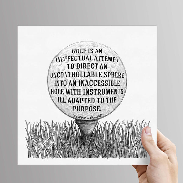 Female hand holds an unframed copy of the 8 by 8 inch golf quote wall art. The quote on the print reads: golf is an ineffectual attempt to direct an unconstrollable sphere into an inaccessible hole with instruments ill-adapted to the purpose, by Sir Winston Churchill. Available to buy from wit and wisdom dot uk dot com.